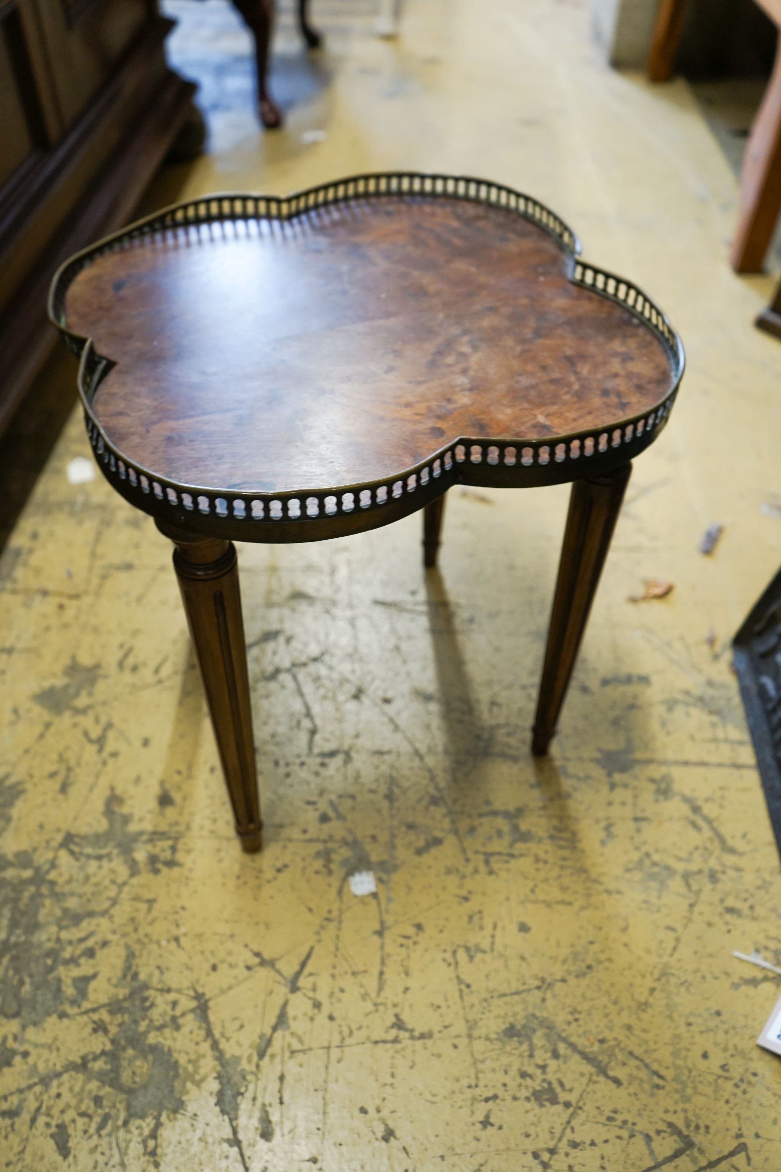 A circular burr walnut cabriole leg coffee table, diameter 84cm, height 47cm together with two Continental mahogany side tables with fretted brass galleries